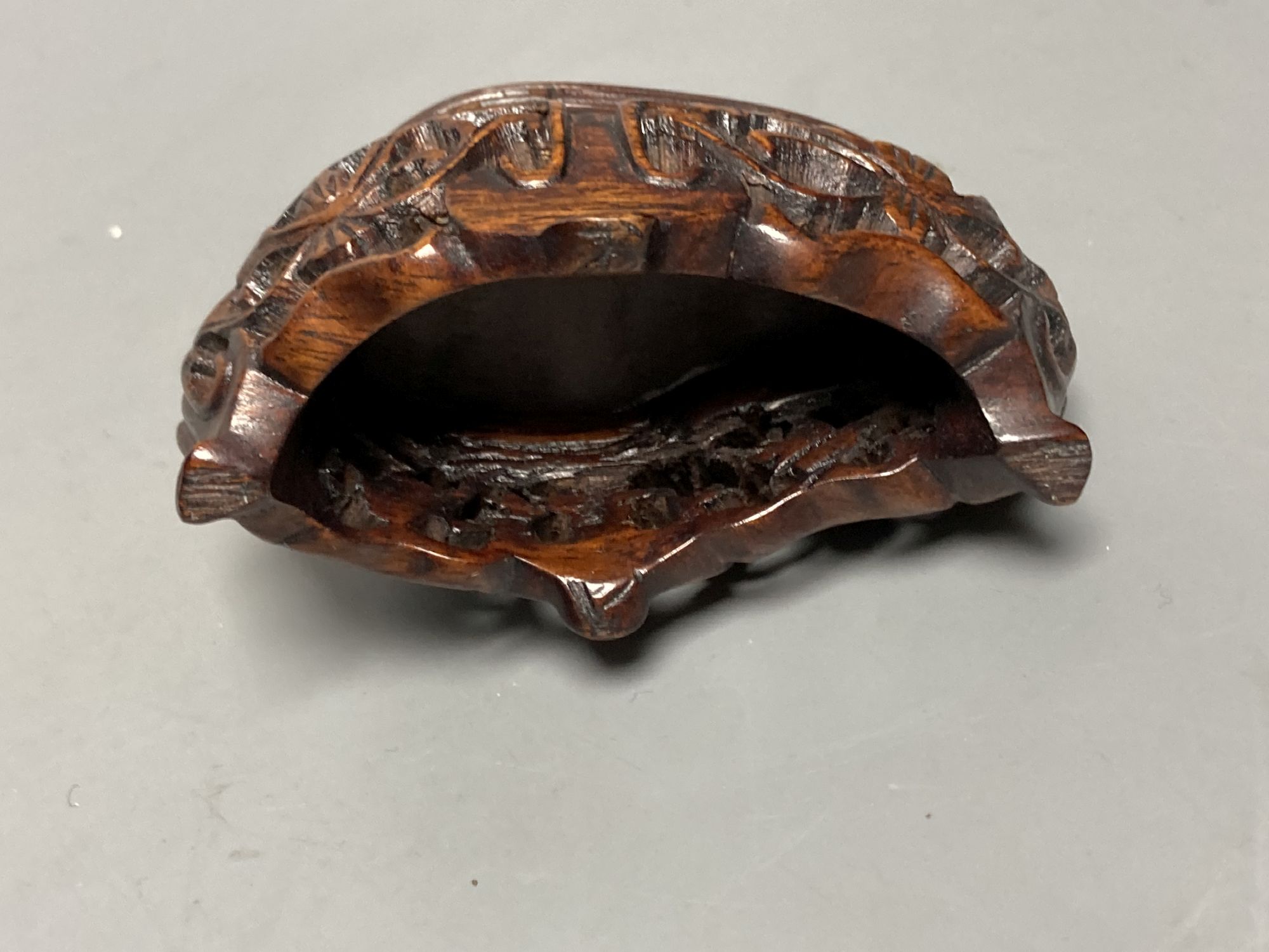 An early 20th century Chinese agate group of Guanyin and two boys, wood stand